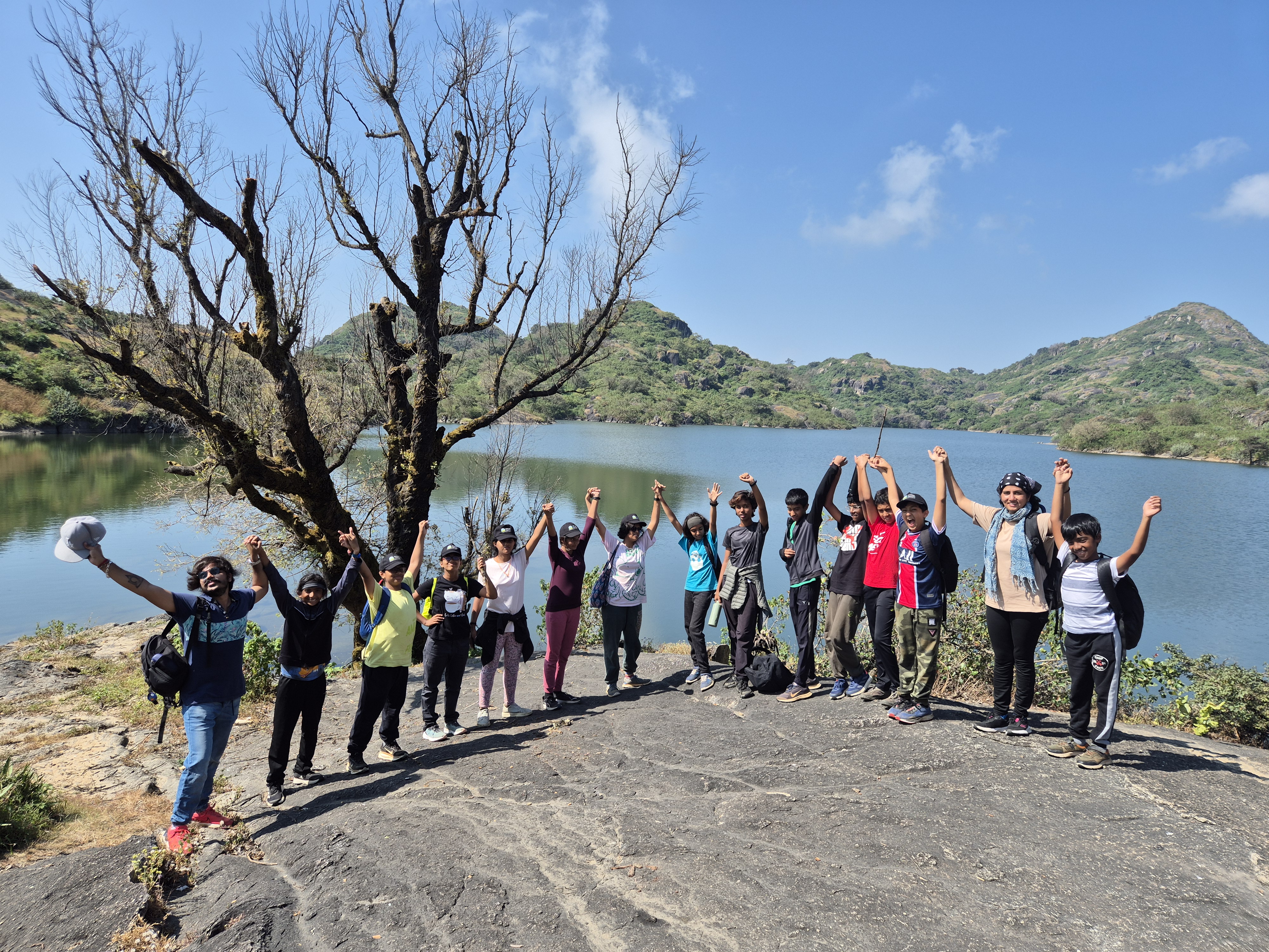 Group celebrating at the lake, Mount Abu